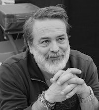 a black and white photo of a man with a beard